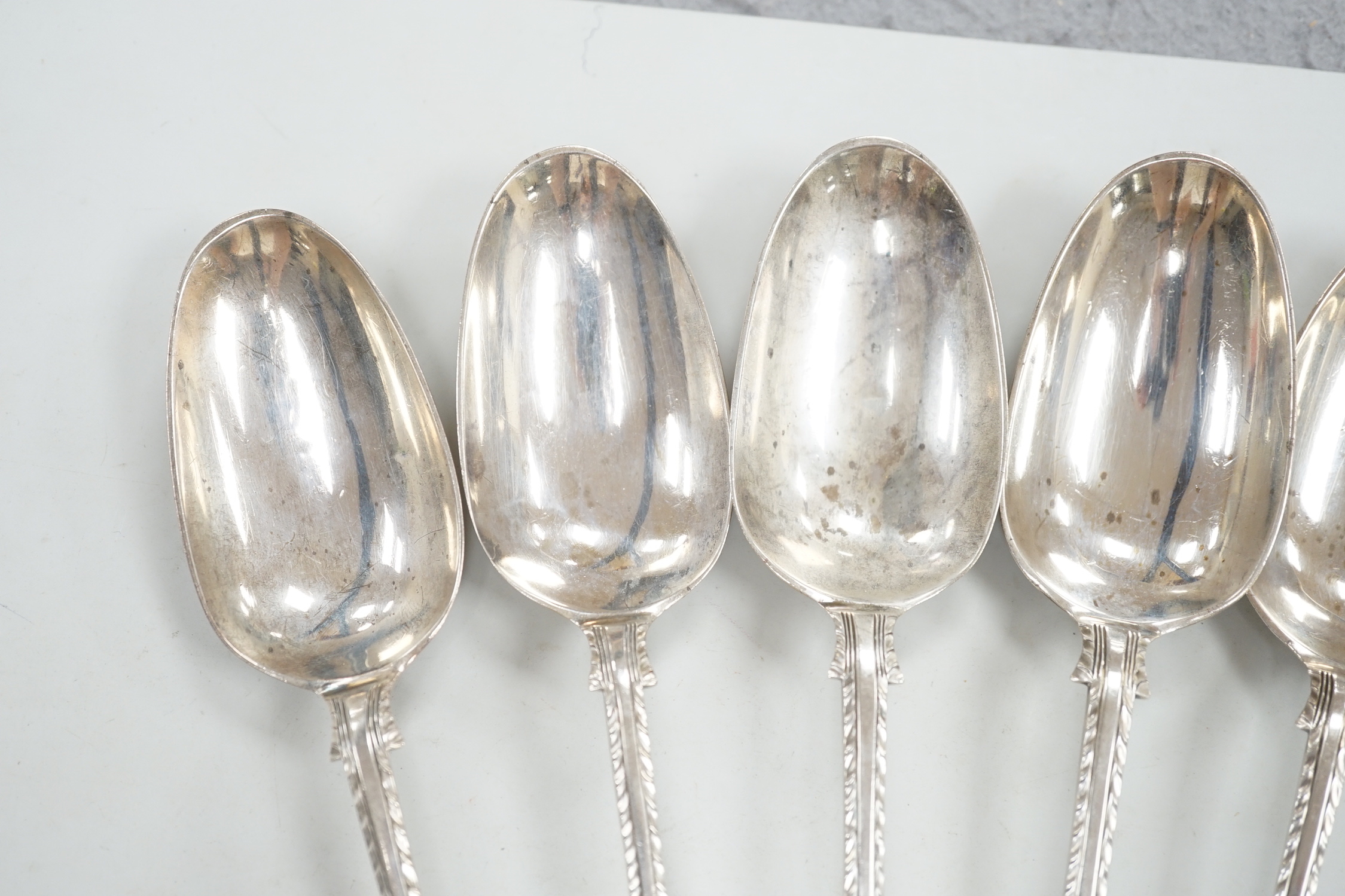 A set of six early George III silver Old English feather edge table spoons, Thompson Davis, London, 1764, 21.3cm, 12.6oz.